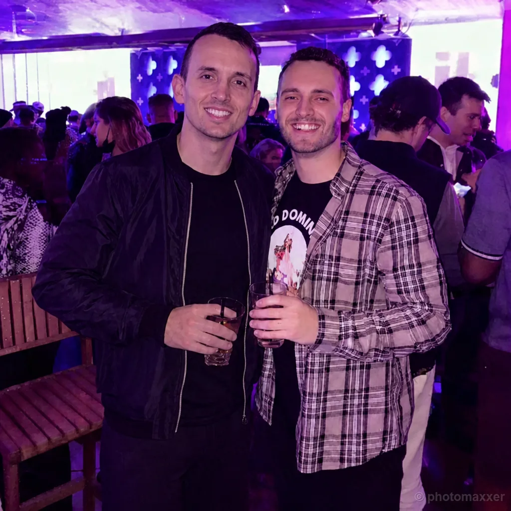 AI-generated example of two men smiling together at a nightclub.