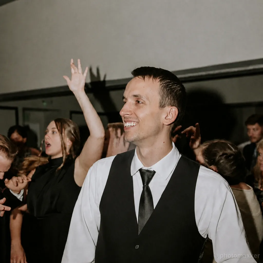 AI-generated example of a man smiling on a wedding dance floor.